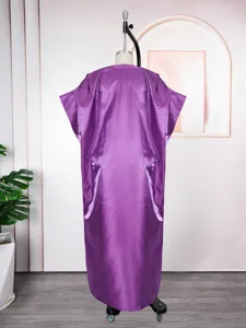 Detailed view of the elegant purple satin loose casual long robe dress on mannequin display.