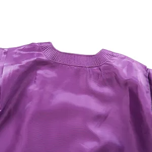 Purple satin dress detail, ribbed square neckline close-up, elegant casual apparel.