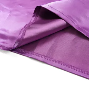 Purple satin fabric detail shot showing smooth texture and exquisite stitching craftsmanship.