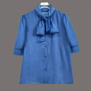Close-up view of the elegant solid color bow tie half sleeve shirt top, premium fabric texture.