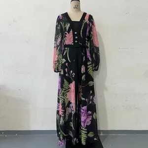 Black floral print long sleeve V-neck dress detail view with stylish waist belt design.