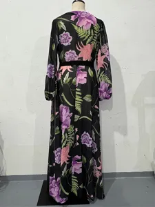 Back detail of floral long sleeve maxi dress featuring vibrant purple flower and fern print.