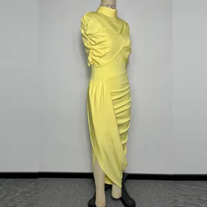 Detail view of a bright yellow high-neck asymmetric draped midi dress for women, elegant style.