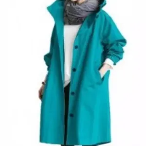 Turquoise women trench coat detail featuring hooded design, long sleeves and button closure.