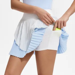 Pleated sports skirt detail showing convenient side pocket with tennis ball, activewear.