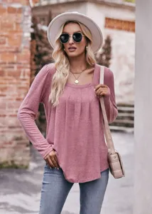 Detailed close-up view of the stylish long sleeve square neck pleated top worn outdoors.