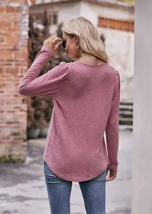 Detailed view of women casual long sleeve puff sleeve textured top in stylish design.
