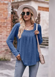 Detail view of women's casual blue square neck long sleeve puff sleeve pleated top.