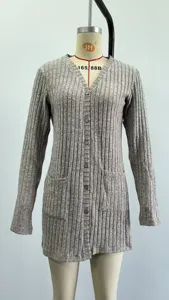 Detailed view of grey ribbed knit cardigan featuring V-neck, front buttons and pockets.