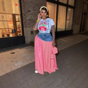 Detailed look at the women short sleeve graphic t-shirt and denim spliced pink plaid skirt set.