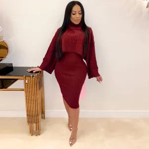 Detailed view of women's turtleneck sweater and knitted midi dress set in rich burgundy.