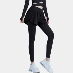 Detail view of women's black activewear, featuring cutout long sleeve top and fake two-piece yoga pants.