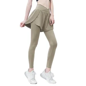 High waist 2-in-1 fitness yoga pants with built-in skirt for running and gym workouts.
