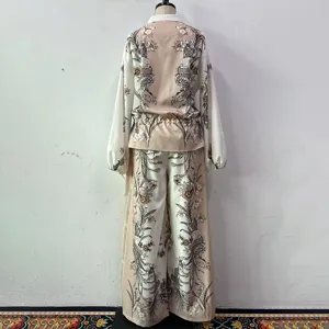 Women two piece outfit long sleeve top and wide leg pants with elegant floral bird print design.