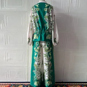 Back detail of the green floral printed two-piece outfit showcasing the intricate botanical patterns.