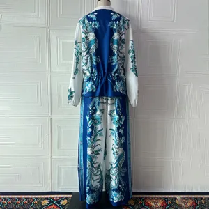 Blue and white floral print two piece set detail view, featuring stylish jacket and pants.