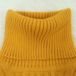 Close-up detail of the yellow knit turtleneck collar, showcasing soft and warm sweater texture.