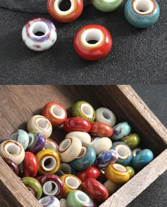 Detailed view of vintage large hole ceramic beads with glaze for DIY jewelry making.