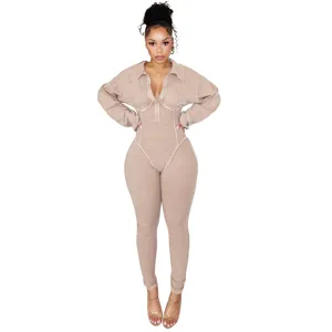 Detail view of the sexy washed distressed deep v-neck long sleeve ribbed jumpsuit for women.