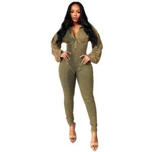 Detailed view of the washed green long-sleeve ribbed jumpsuit, showcasing the slim fit.