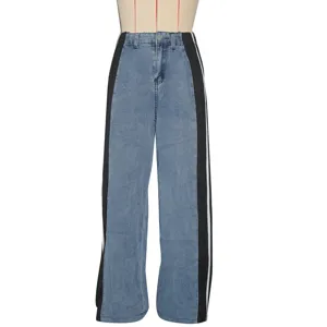 Close-up of women's high-waist wide-leg denim jeans featuring stylish side color-block stripes.