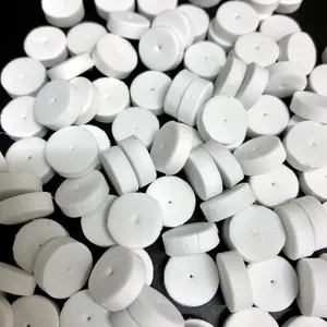 White round foam cushion pads with central holes for jewelry earring packaging and backing pins.