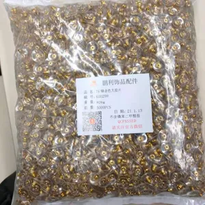 Bulk gold-toned bullet clutch earring backs with clear plastic pads, essential jewelry making findings.