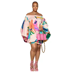 Robe mini femme épaule dénudée imprimé abstrait manches ballon style mode chic.