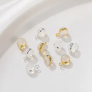 Transparent silicone earring backs with gold and silver metal loops, secure jewelry findings.