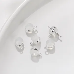 Clear silicone earring backs with metal loop, secure locking stoppers for stud earrings.