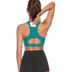 Back detail view of green sports bra with convenient phone pocket and racerback design.