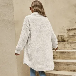 Detail view of a cozy white fluffy teddy fleece coat, long sleeve outerwear for autumn and winter