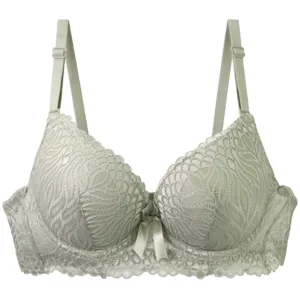Detailed view of the light green lace padded bra featuring elegant floral patterns and straps.