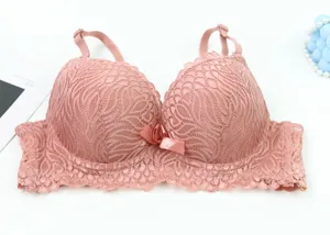 Detailed view of the pink lace push-up bra, featuring delicate floral patterns and a cute bow.