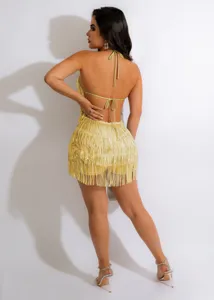 Detailed view of women's sequin fringe halter romper back design, sexy party style clubwear.