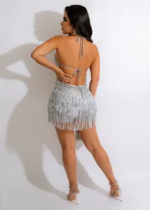 Silver sequin fringe halter romper backless detail view, sexy clubwear party outfit fashion.