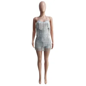 Close-up detail of sexy silver sequin fringe halter neck romper, party clubwear style.