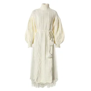 White turtleneck cable knit sweater dress with mesh hem and tassel waist belt set for women.