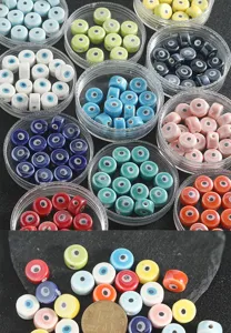 Detailed view of colorful evil eye ceramic loose beads for DIY bracelet jewelry making accessories.