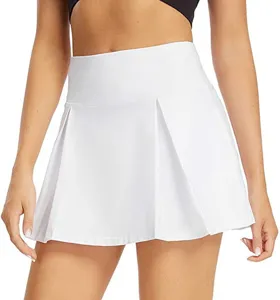 Detail view of the white athletic pleated tennis skirt, showcasing high waist and fabric texture.