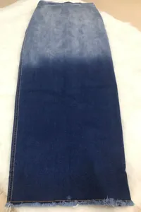 Gradient blue denim long skirt with frayed raw hem, stylish casual women streetwear.