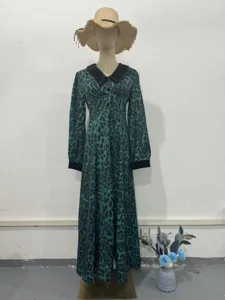 Elegant green leopard print maxi dress with black contrast collar, waist-cinching slim fit design.