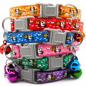 Adjustable 1cm pet collar detail showing colorful cartoon print, plastic buckle, and bell.
