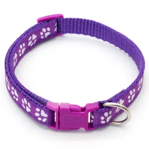 Purple nylon pet collar with white paw print pattern, durable buckle and metal D-ring.