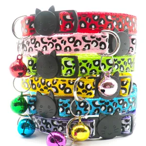 Detailed view of colorful leopard print pet cat collar featuring safe buckle and small bell.