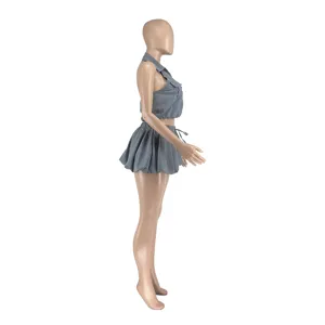 Detailed side view of trendy grey sleeveless backless crop top and bubble mini skirt set.