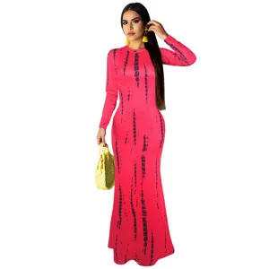 Close-up view of the pink tie-dye long sleeve maxi dress detail, fitted style fabric.