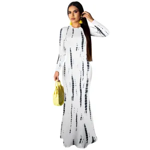 Detail view of the long sleeve slim fit tie dye maxi dress showing pattern and fit closely.