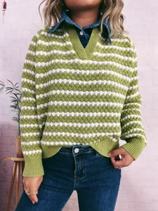 Close-up detail of the green and white textured striped sweater featuring a denim lapel.