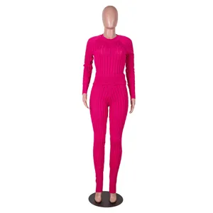 Women solid color ribbed knit two piece set, long sleeve sweater and high waist pants outfit.